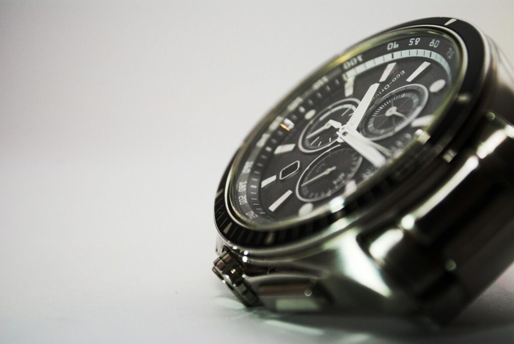 Detailed shot of a luxurious stainless steel wristwatch showcasing precision and style.