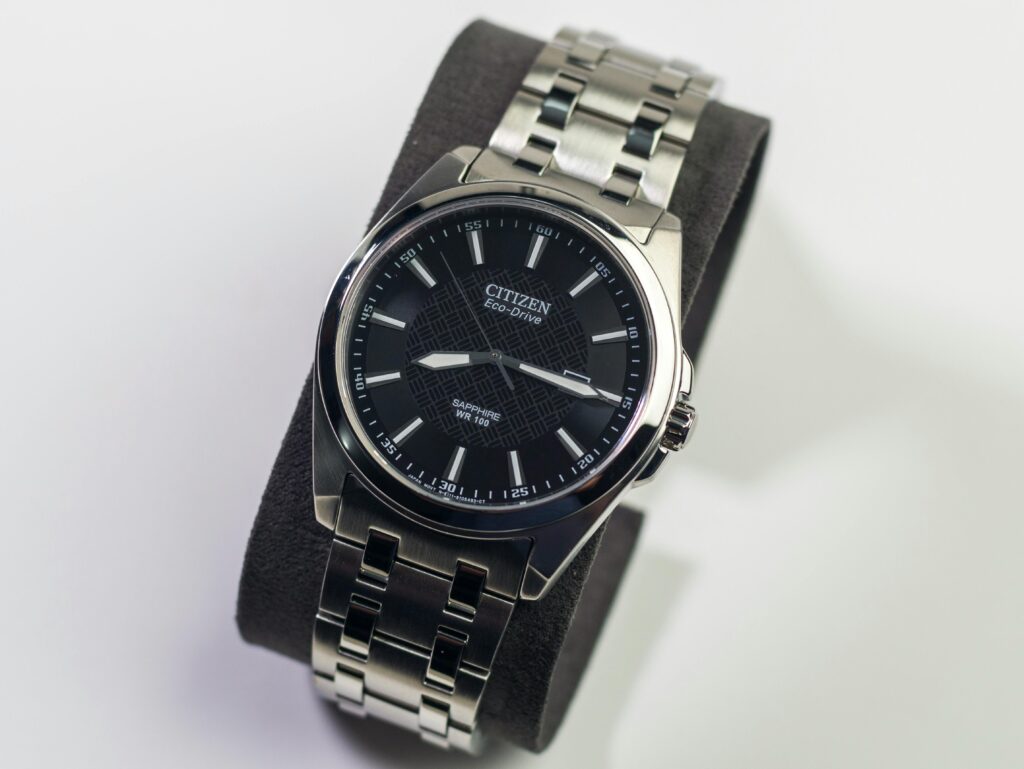 Close-up of a classic Citizen Eco-Drive wristwatch with a stainless steel bracelet.