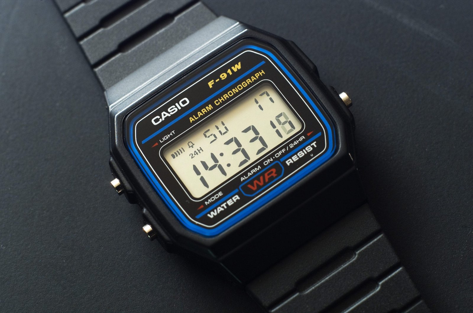 Casio F-91W digital watch with the LCD display showing the time