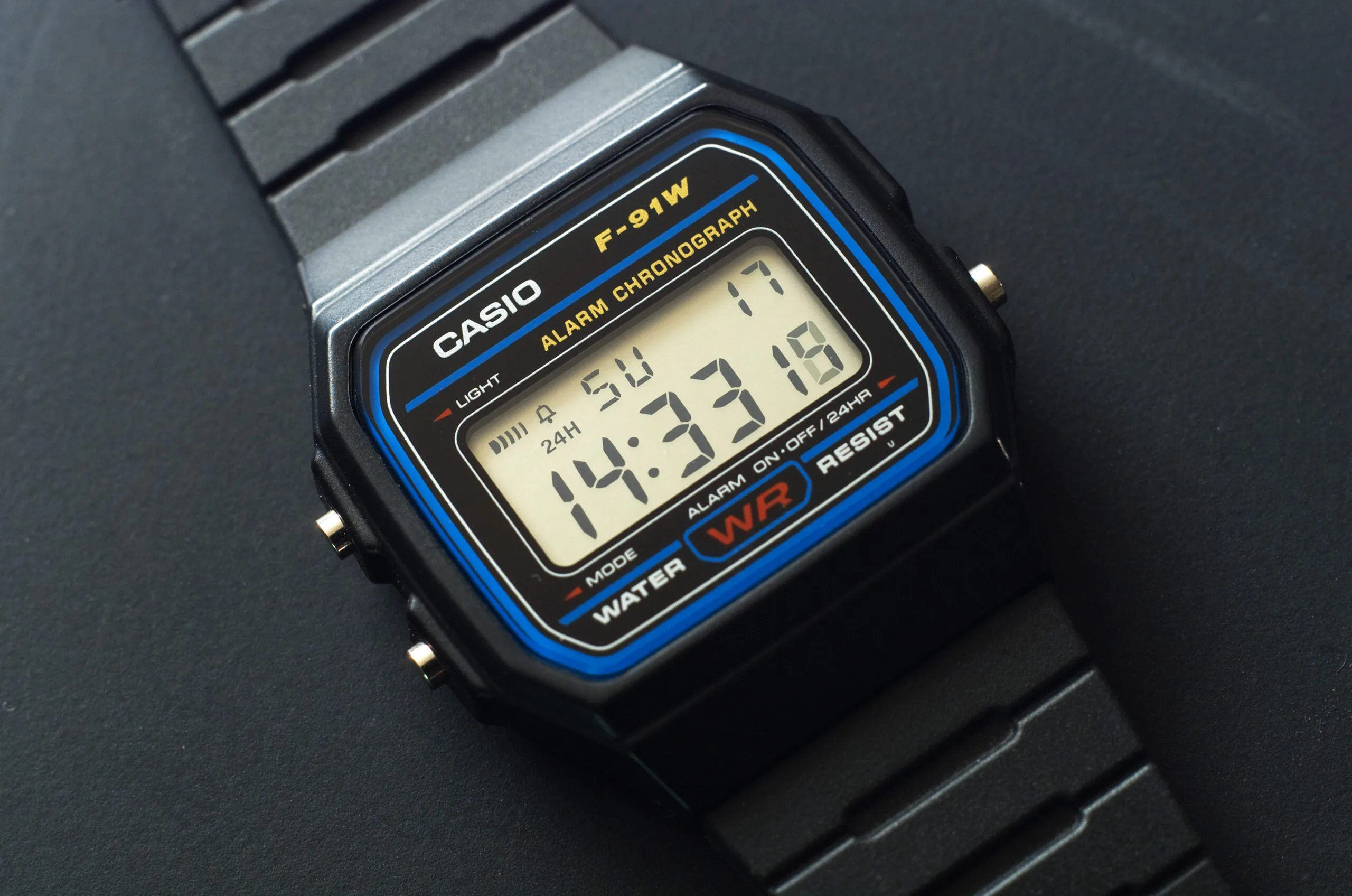 Casio F-91W digital watch with the LCD display showing the time