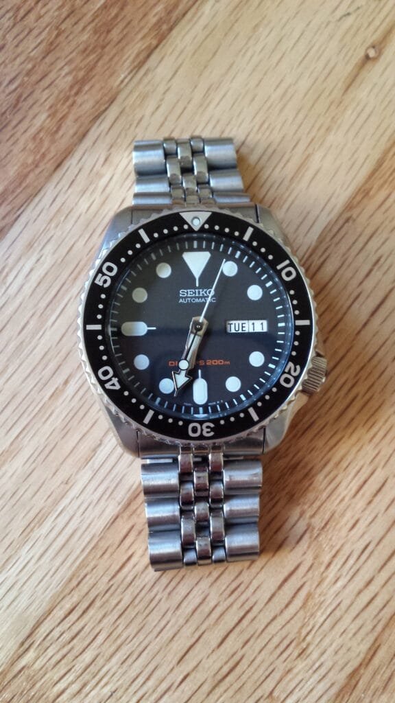 Seiko SKX007K on the wrist with its aluminium bezel insert