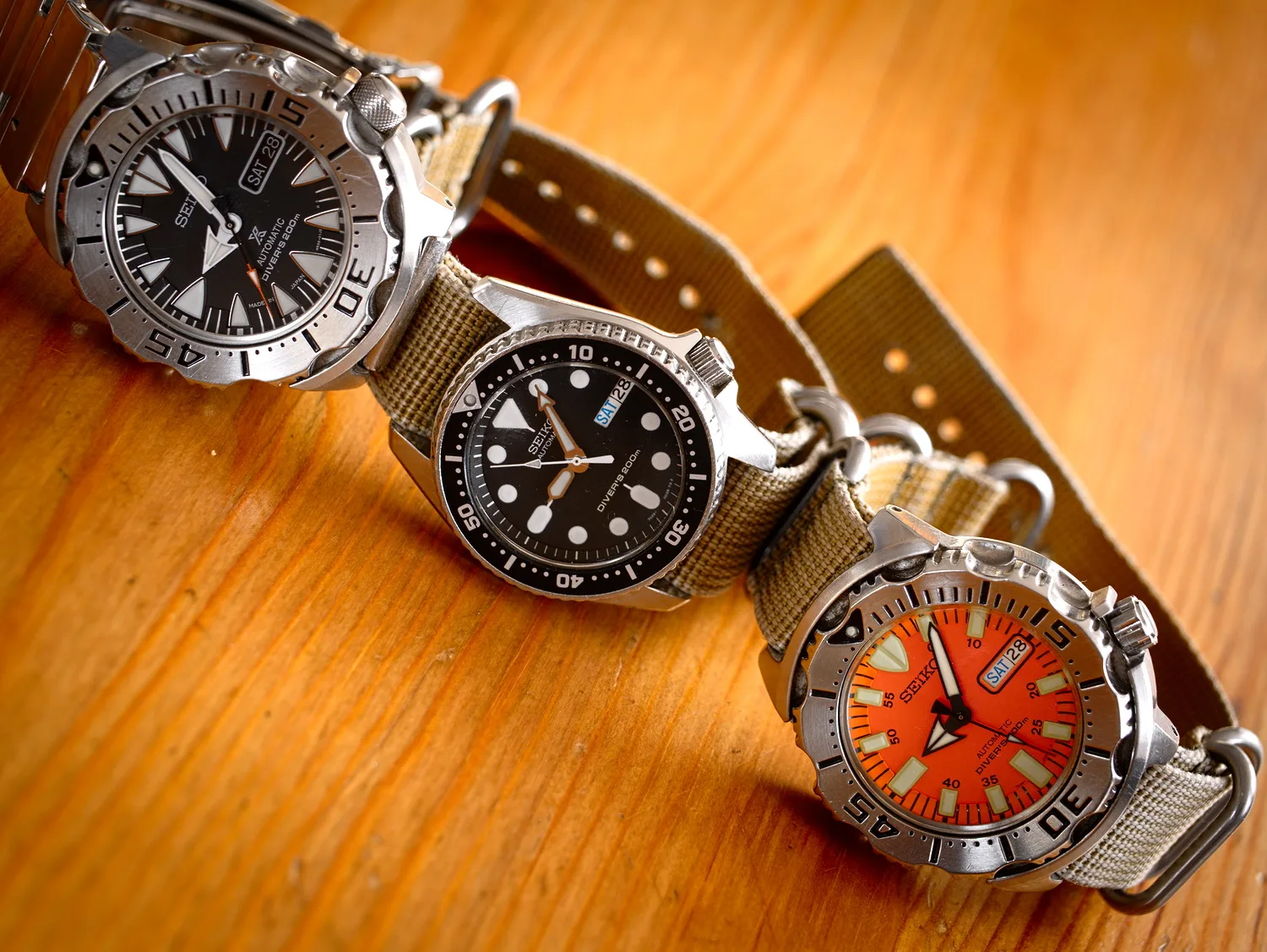Three Seiko automatic dive watches with large luminous hour markers