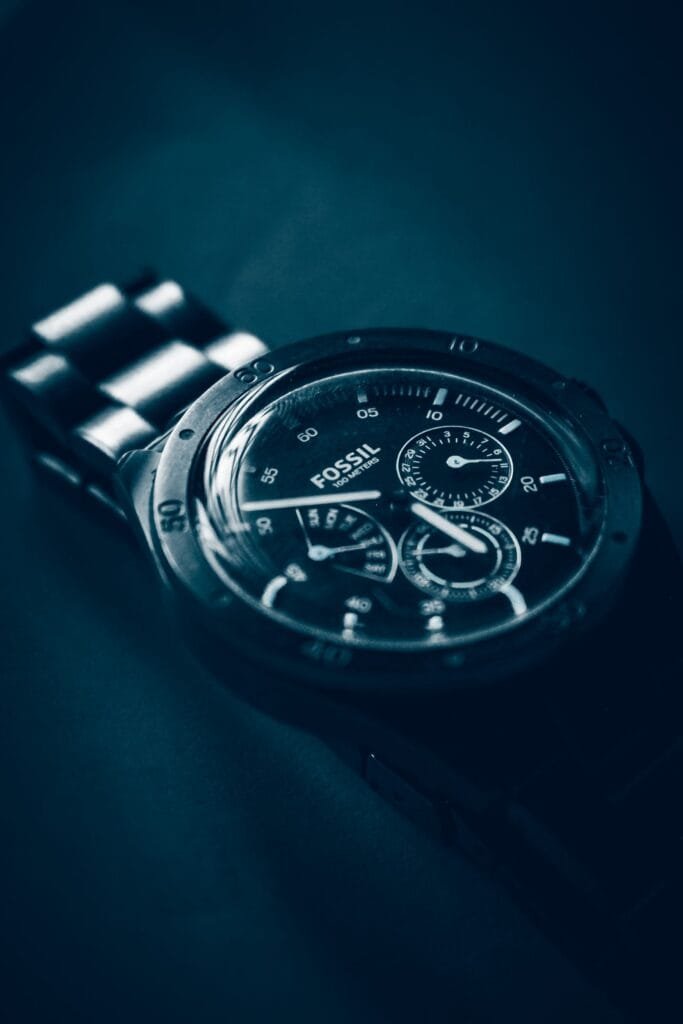 Black Fossil chronograph wristwatch with pushers either side of the crown